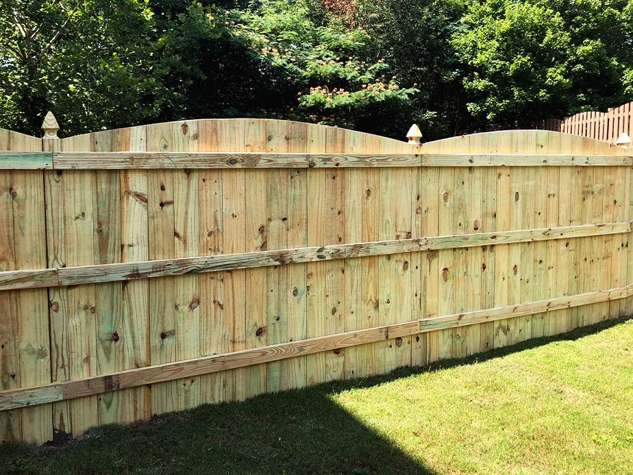 Wood privacy fence showing its rails and supports