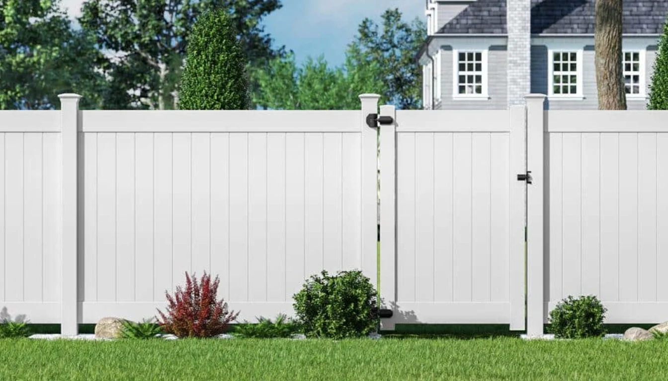 White vinyl privacy fence along a home