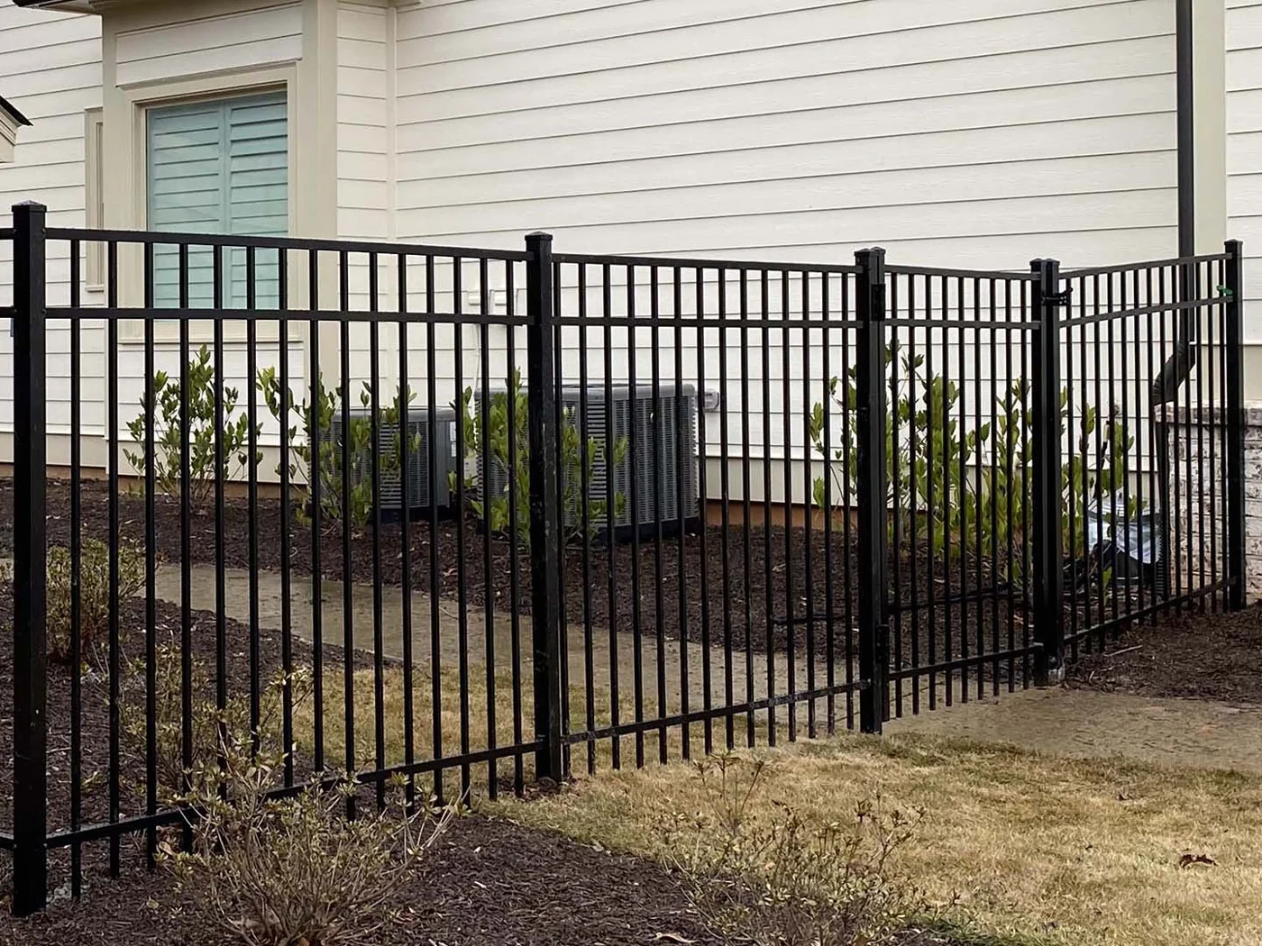 Aluminum fence following a property boundary