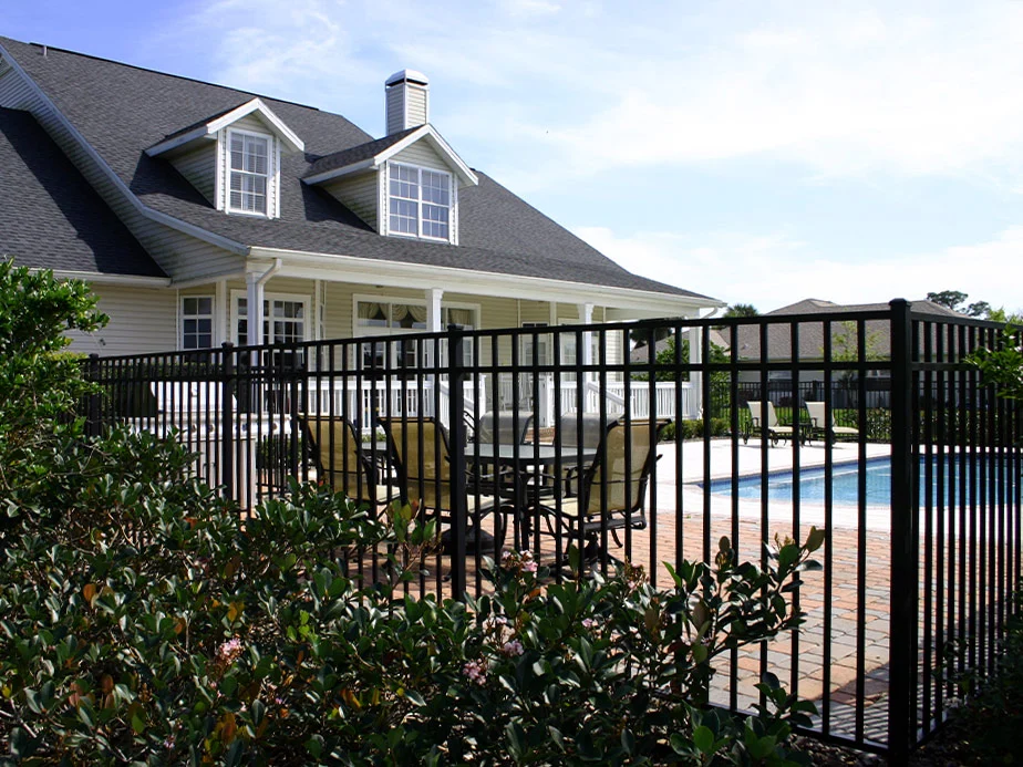 Ornamental metal fence bordering a patio