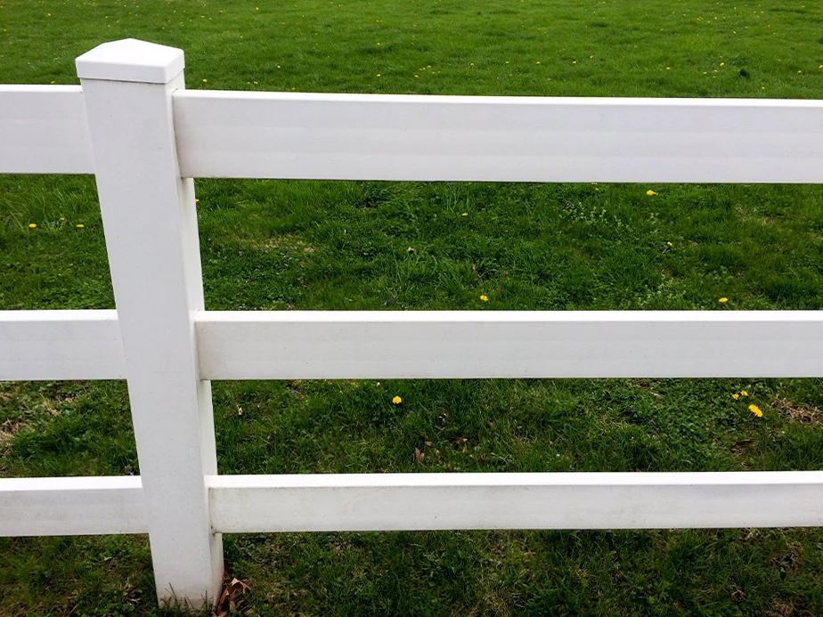 White vinyl rail fence with an open view
