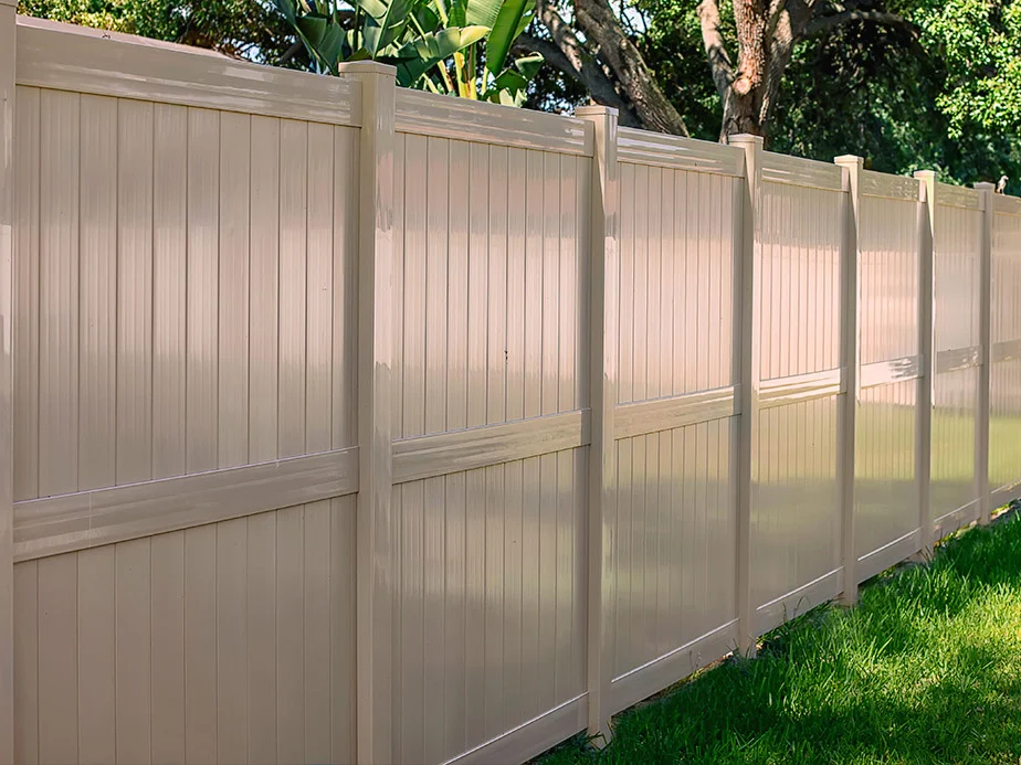 White vinyl privacy panels along a property