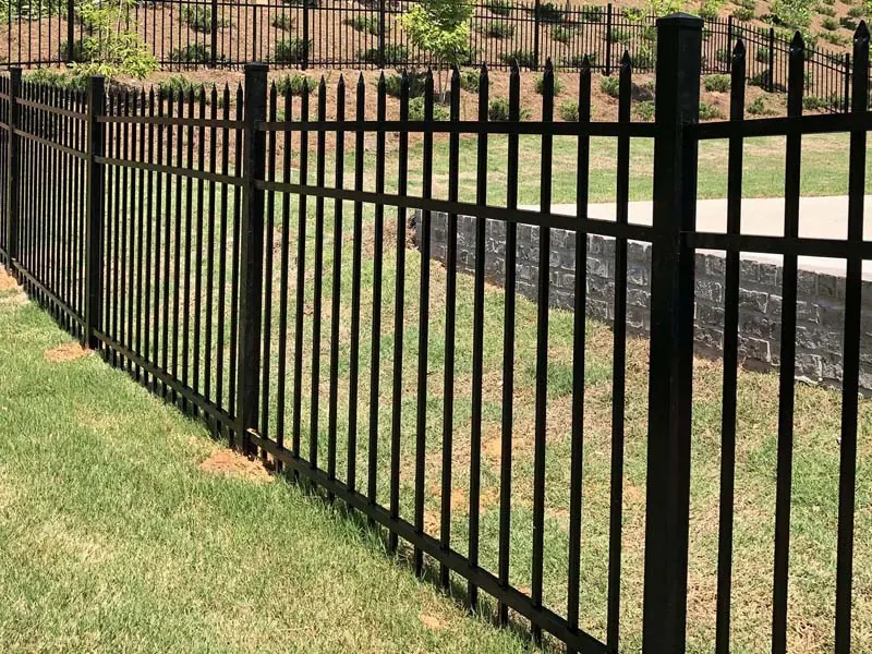 Ornamental metal fence along a residential property