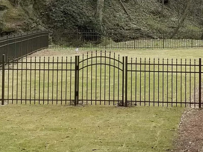 Arched metal gates at an open property