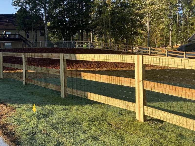Post-and-board fence with wire infill
