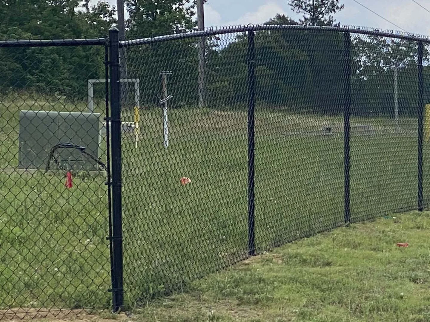 Chain-link enclosure around a play area