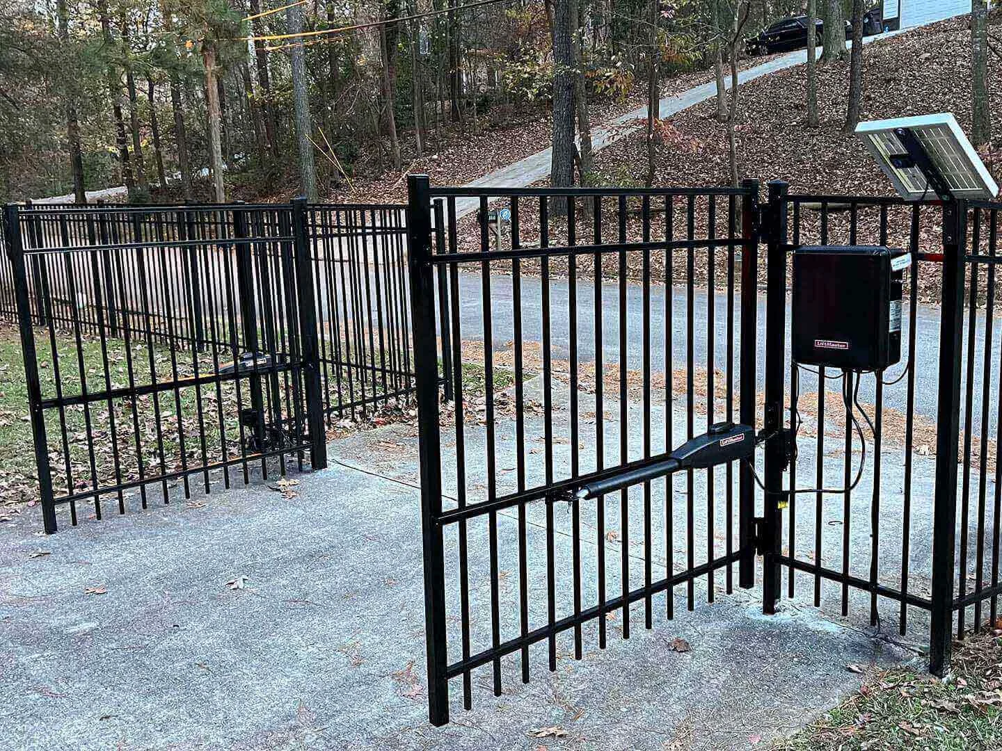 Powered metal gate and adjoining pedestrian access