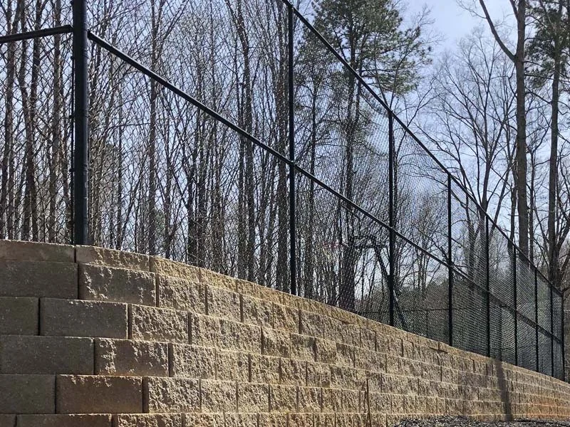 Chain link above a retaining wall