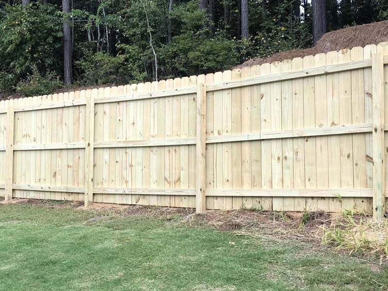 Long wood fence showing rails and supports