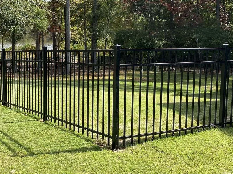 Open metal fence around a lawn